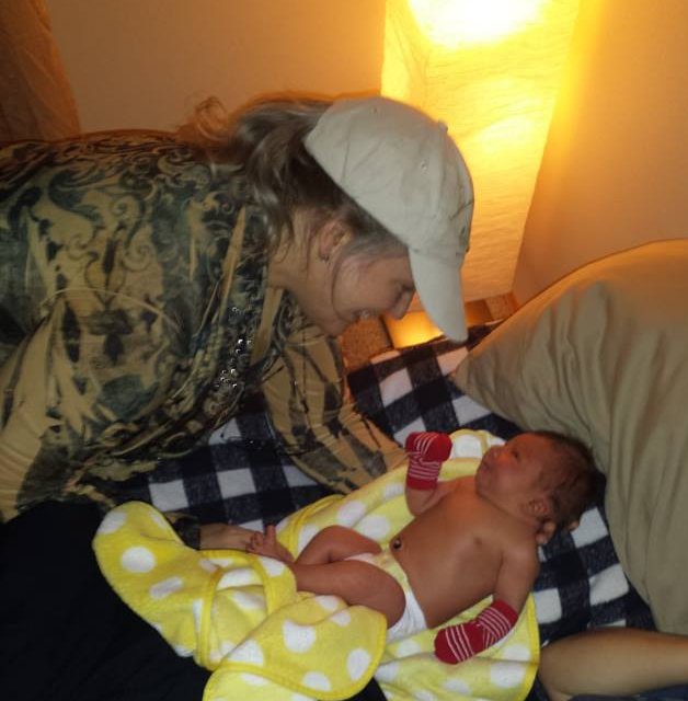 Lorri at a home visit for newborn checkup, Highland Midwife